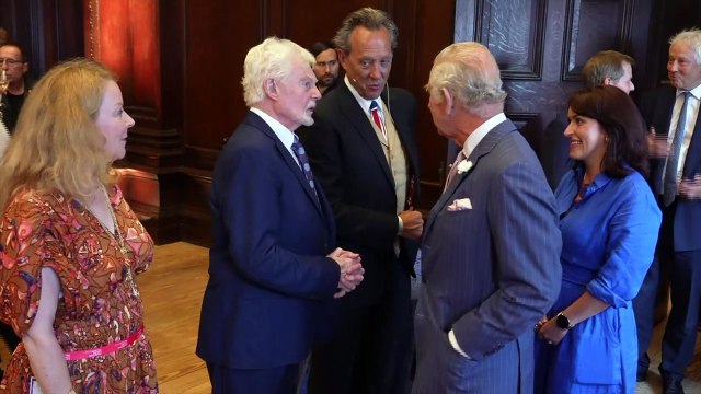 Queen Camilla greets Dame Judi Dench at royal reception