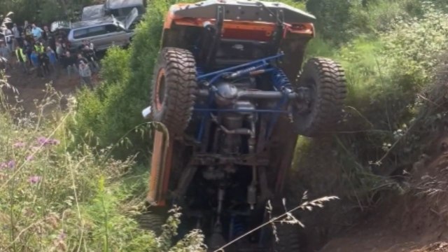 Car trying to climb a hill flips backward because of the steepness *Off-road car fail*