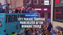 Rain and champagne: Man City celebrate this season's treble with fans