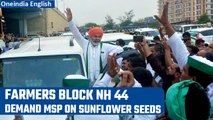 Farmers block Delhi-Chandigarh highway, demand MSP on sunflower seeds | Oneindia News