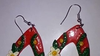 Polymer clay Hand crafted flowers on orange drop shaped earring..