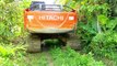 Hitachi 210 MF Excavator in Action When Passing Through Trenches