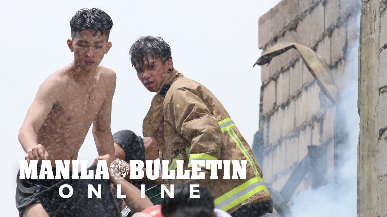 Residents battle fire in a residential area at Mandaluyong