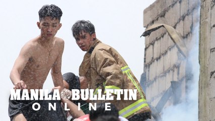 Residents battle fire in a residential area at Mandaluyong