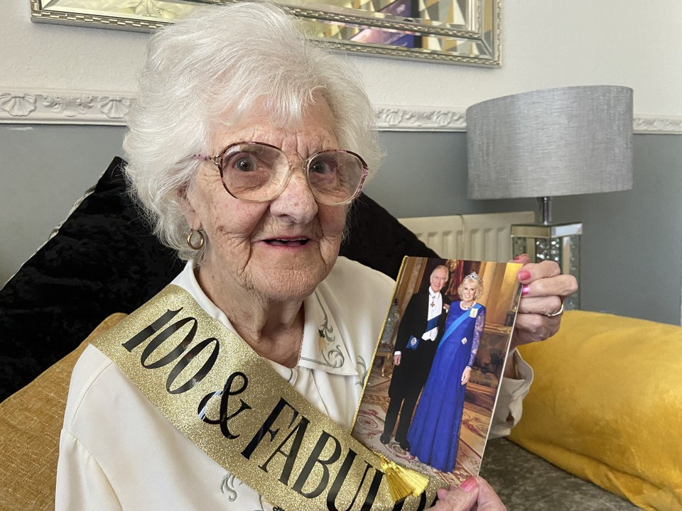 Family woman celebrates 100th birthday with a card from the King