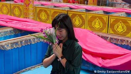 Why some Thai people lie in coffins and other rituals