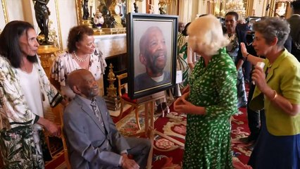 King and Queen meet Windrush portrait sitters in Buckingham Palace