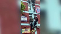 Students flee burning bnuilding by climbing down rope in India