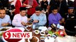 Anwar enjoys grilled fish with rice for lunch at Cyberjaya food court