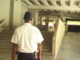Skateboarder does 180 off of stairs and crashes into security guard