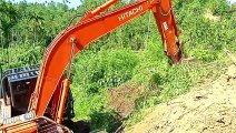 Hitachi 210 MF Excavator Efficient Palm Land Clearing in Mountain Plantations
