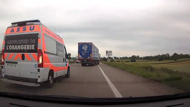 Ambulance on the highway in traffic jam