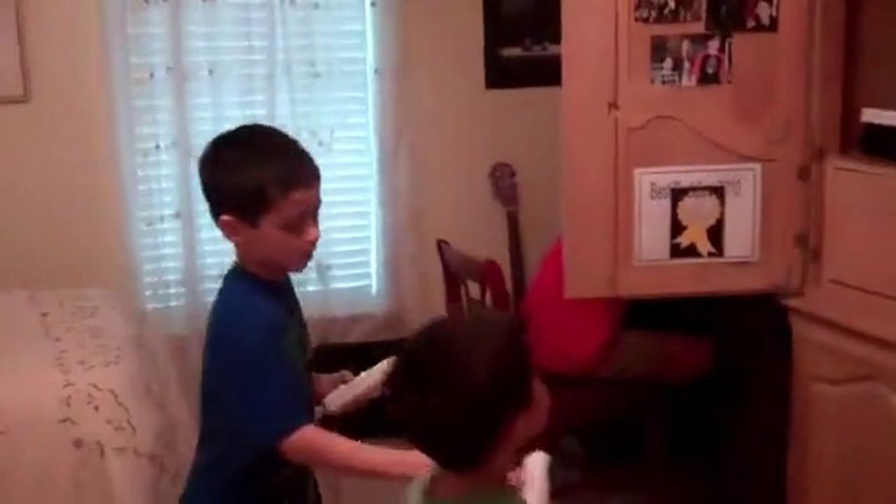 Christopher & Anthony playing boxing on the wii while Jonathan plays on my computer