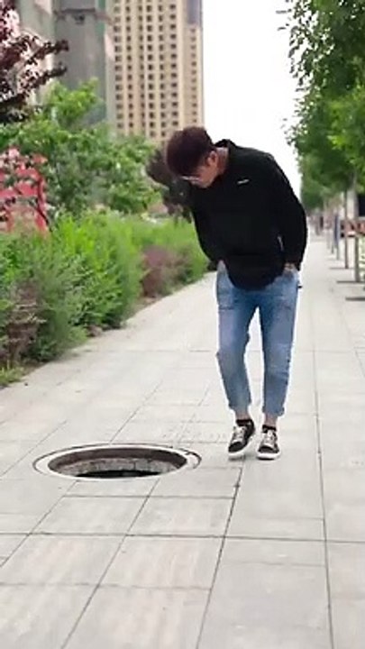 The_Manhole_Cover_is_Gone,_the_Owner_and_the_Dog_Set_Up_Signs_to_Remind_Passers-by(360p)