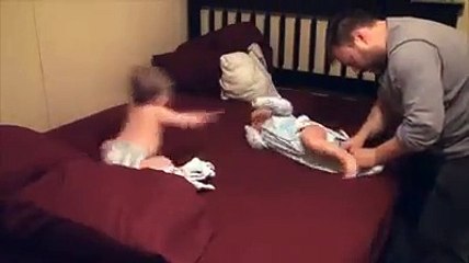 This is what it's like to get twin babies dressed