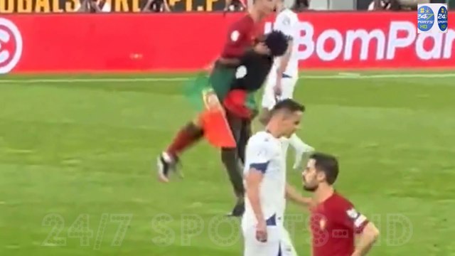Shocking Moment: Cristiano Ronaldo Gets Lifted into the air by a Bold Pitch Invader During Portugal's Euro Qualifier against Bosnia