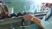 ماكينة ليبل, آلة وضع العلامات على الزجاجات المستديرة الأوتوماتيكية بالغراء الرطب