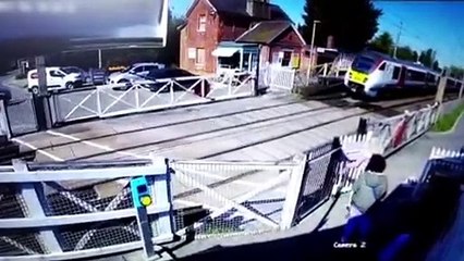 Pedestrian just two seconds away from being hit by a speeding train