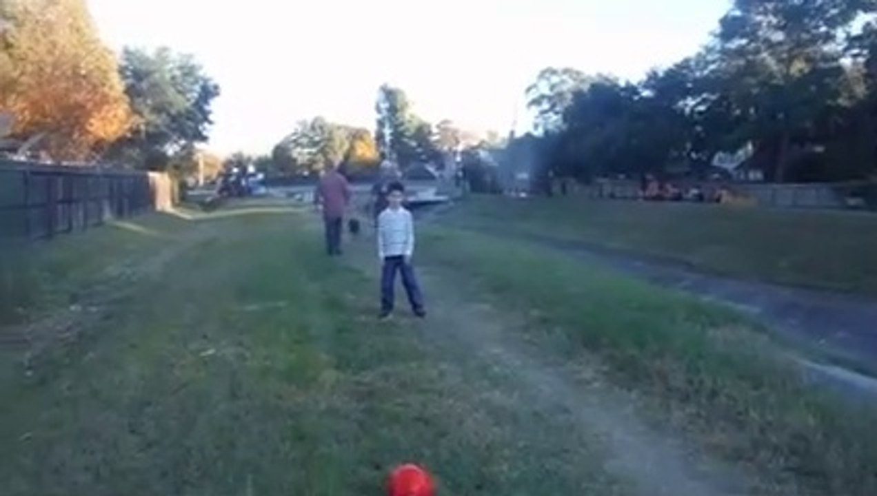 Christopher & Anthony playing soccer on the ditch
