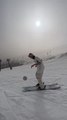 Skier Juggles Football While Performing Skiing Tricks