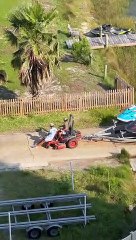 Guys Use Lawn Mower to Launch Jet Skis