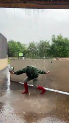 Farmer Sarah dances in the rain at White Post Farm