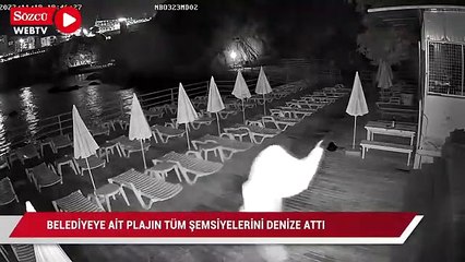 Önce dans etti ardından plaj şemsiyelerini denize attı