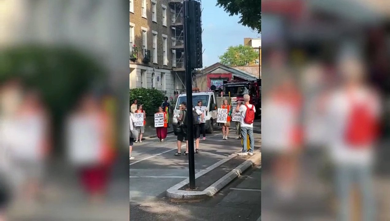 Watch angry homeowner throw buckets of water on Just Stop Oil protestors from balcony