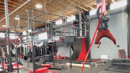 Acrobat's dream of pulling off a perfect leap snaps like the pole he tries to grab