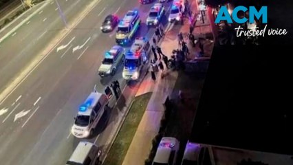 Woman falls three metres through window in wild bar brawl