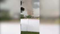 Huge tornado rips through suburban areas in Indiana sending debris into the air