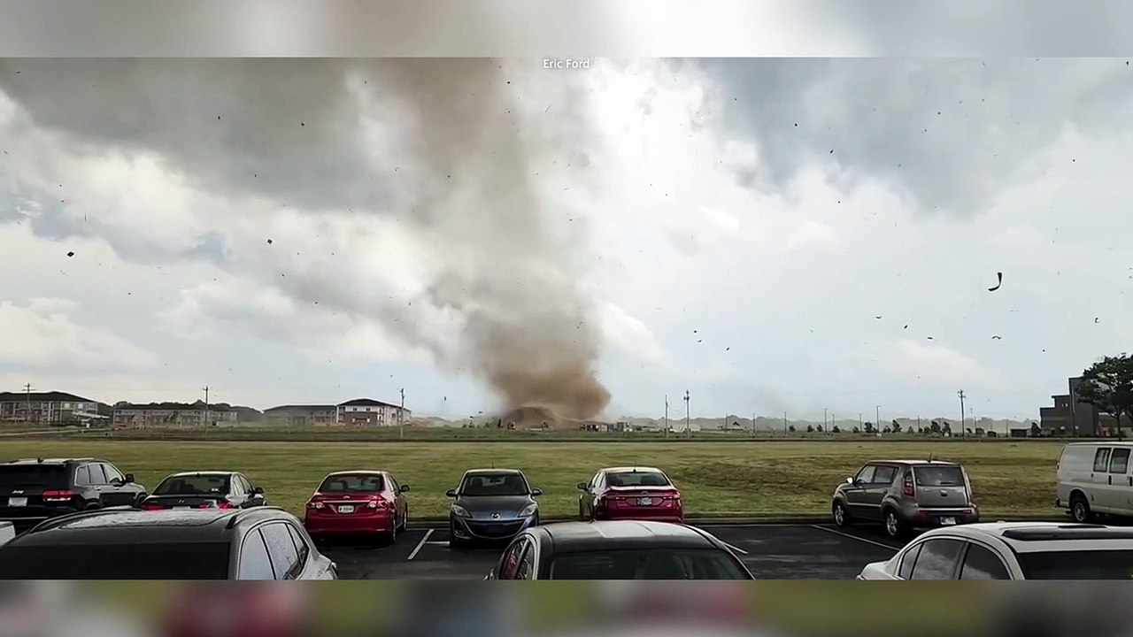 Huge tornado rips through suburban areas in Indiana sending debris into the air