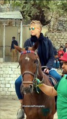 A beautiful woman riding horse