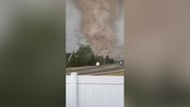 Terrifying moment massive tornado sends debris flying through air