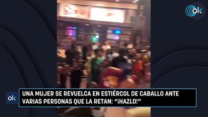 Una mujer se revuelca en estiércol de caballo ante varias personas que la retan ¡Hazlo!