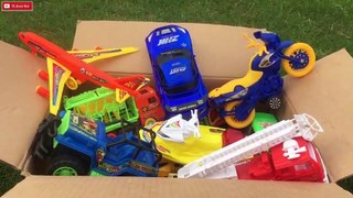 Box full of colorful various toysKTM Bike CNG Auto Sports Car  