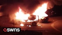 French riot police patrol the streets of Strasbourg as firefighters tackle vehicle fires after unrest