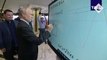 Putin draws bizarre smiley face on electric whiteboard in Moscow