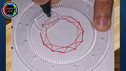 DIBUJANDO con un espirógrafo un mandala rojo y negro. DRAWING with a spirograph a red and black mandala.