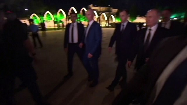 Russian state television shows President Vladimir Putin meeting a crowd of well wishers