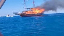 Dramatic Moment_ Dozen British Tourists Rescued After Abandoning Enflamed Greek Boat