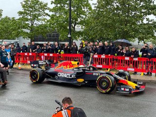 Daniel Ricciardo drives Red Bull Racing car in Milton Keynes