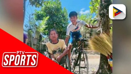 Download Video: Siklistang hila ang kanyang ama na naka-wheelchair habang nagbibisikleta, nagbigay inspirasyon