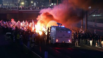 Protesters and police clash as thousands block highway in Tel Aviv