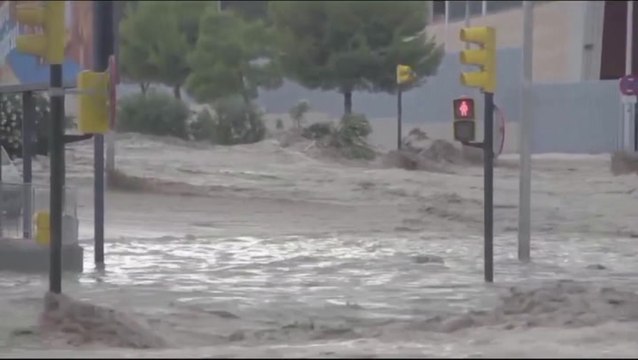 Cars stranded in floodwaters following torrential rain in Spain