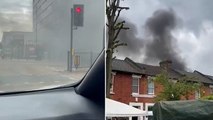 Towering plumes of black smoke pour out of huge east London fire