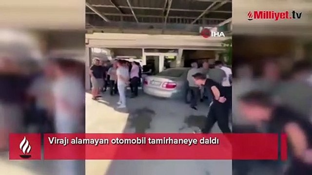 Virajı alamayan otomobil tamirhaneye daldı