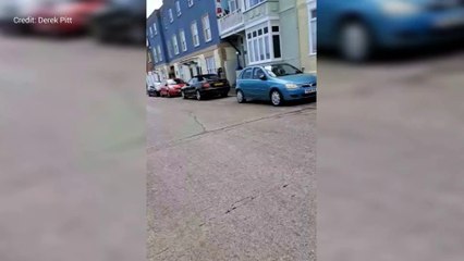 Shocking footage shows speeding biker smash phone out of man's hand