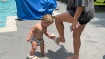 Baby gentleman tries to master the art of walking in someone else's shoes