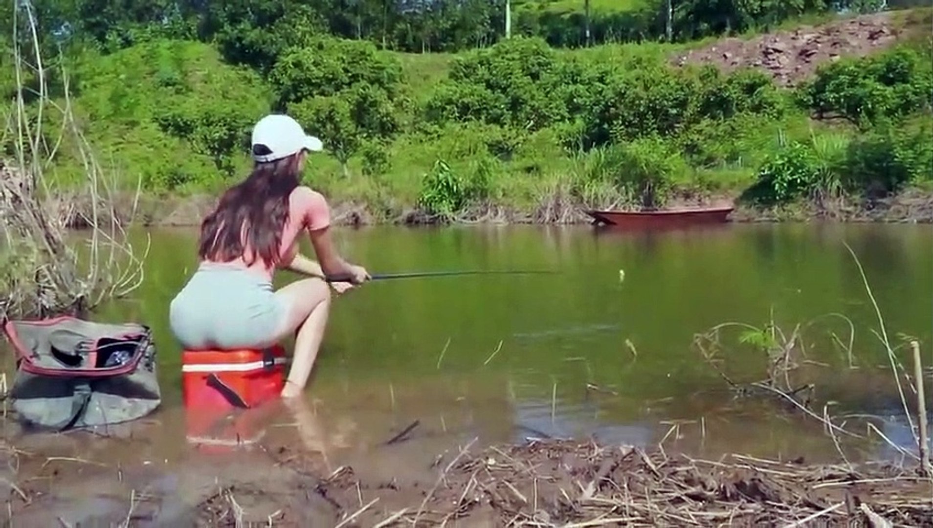 Beautiful Girl Catches a fish originating from the  Forest